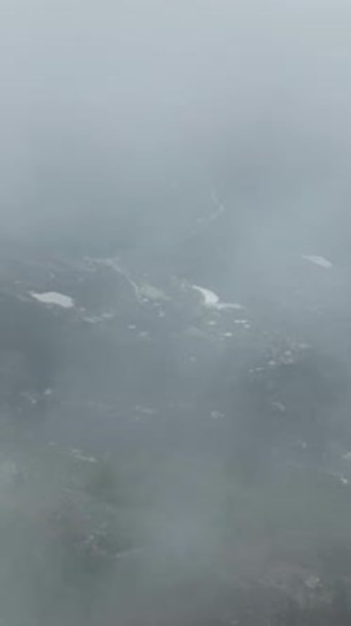 Vertical Video Aerial Exploration of the Mystical Path Dramatic Forest in Cloudy Weather