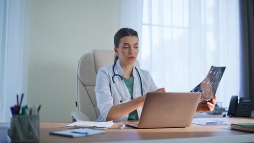 Professional Radiologist Talking Computer in Hospital Office Interior Closeup