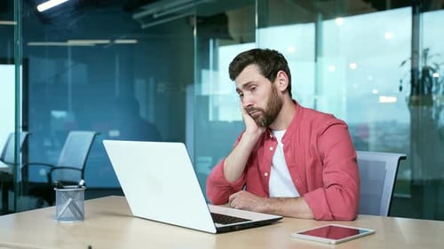 bored men in the office Sleeping sleepy yawning boredom at workplace indoors. Tired man. Exhausted
