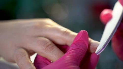 Close up of beautiful female hands manicure treatment in beauty salon 4K