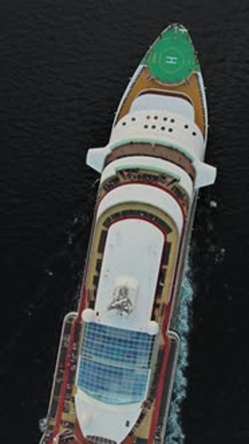 Sailing cruise ship aerial top view
