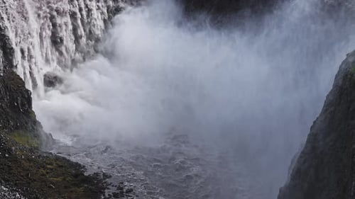 Aerial View of Dettifoss Waterfall Cascading Into a Rocky Canyon