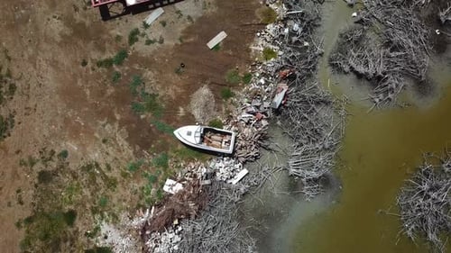 Birds Eye Aerial View of Boat Wreck and Waste on Shore of Puerto Rico, Aftermath of Hurricane Natura