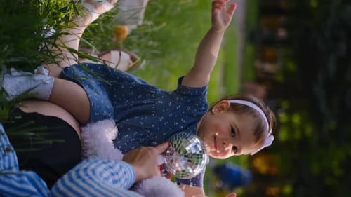 Mother and child together in the park outdoors, lying in the grass. Motherhood happiness concept. Da