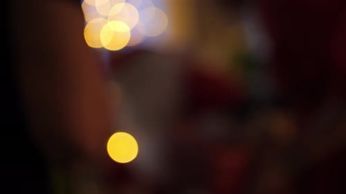 Family celebrating Christmas with Santa Claus, blurry view