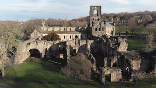 Aerial footage of the ruins of Kirkstall Abbey, a ruined Cistercian monastery in Kirkstall in the UK