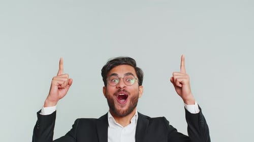 Businessman Showing Thumbs Up and Pointing Overhead on Blank Space Place for your Advertisement Logo