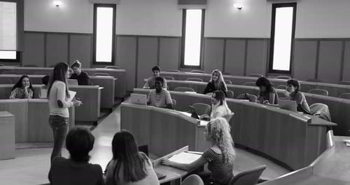 Teacher Working with Students Inside Classroom at School University Academic