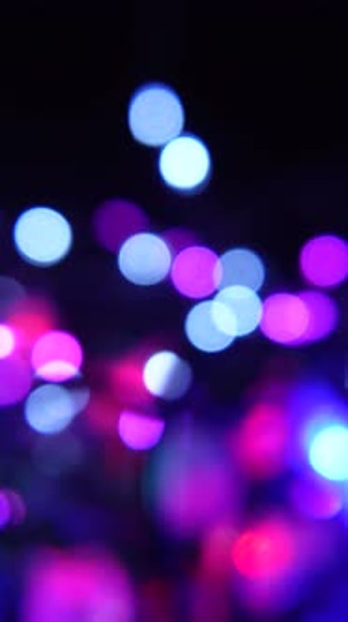 Defocused Multi-Colored Bokeh Lights Background in Portrait Orientation