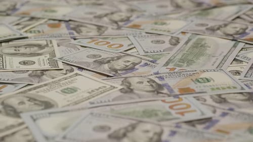 Pile of US Hundred Dollar Bills Close Up