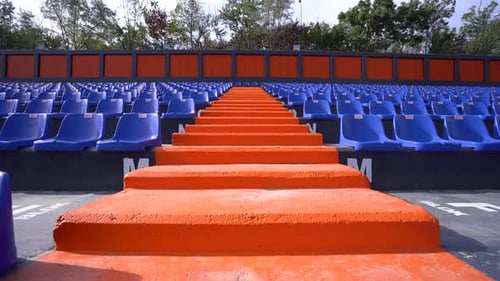 Staircase between blue empty seats in the stadium 4K