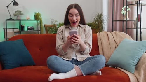 Woman Using Phone Gets Good News