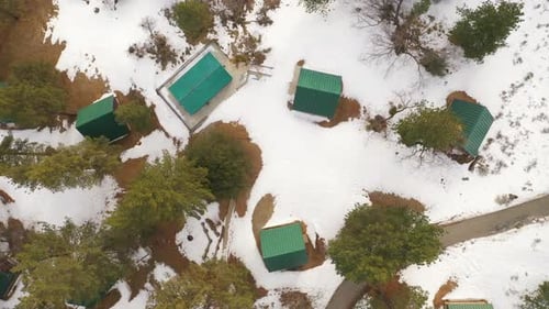 A-frame cabins in the snowy mountains provide warmth and shelter from the winter - straight down aer