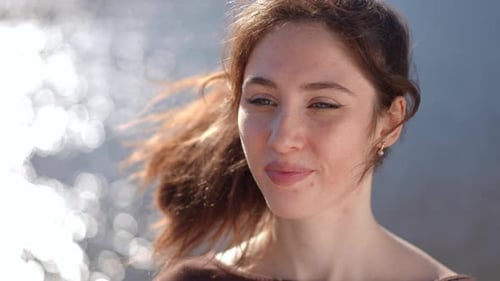 Auburn Haired Woman Relaxing at the Beach
