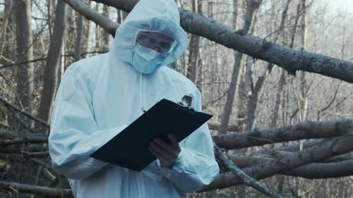 Forensic Specialist Working in the Forest Police Criminalists Collecting Evidence and Making