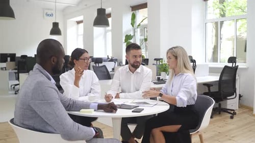 Multiethnic Business People During Meeting in Modern Office