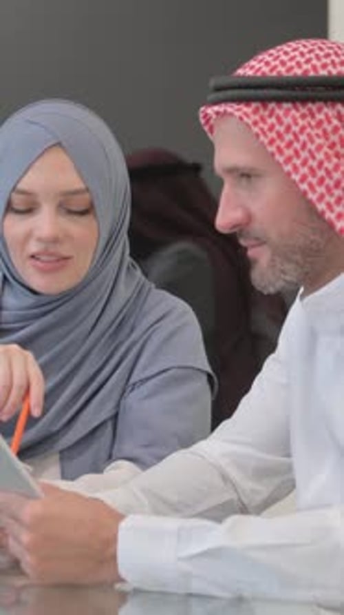 Arab Entrepreneurs Discussing Business in Office, vertical video