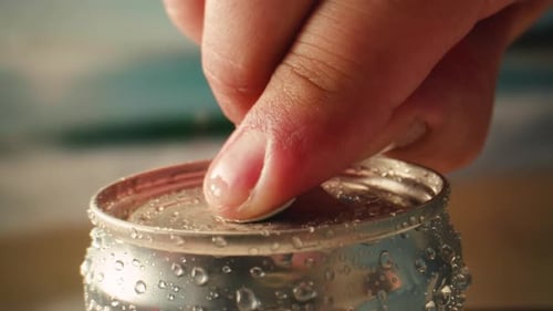 Opening Soda or Beer Can Macro Close Up of Can Pull Tab Opening Watering Refreshment Hand Open