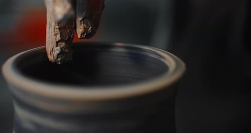 Hand Forming Clay on Pottery Wheel