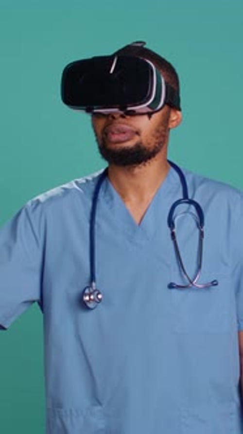 Vertical Video Doctor Wearing Virtual Reality Goggles Remotely Operating Patient