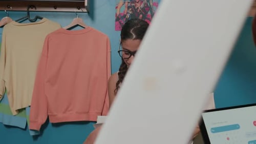 Young Adults Studying Together in a Shared Bedroom