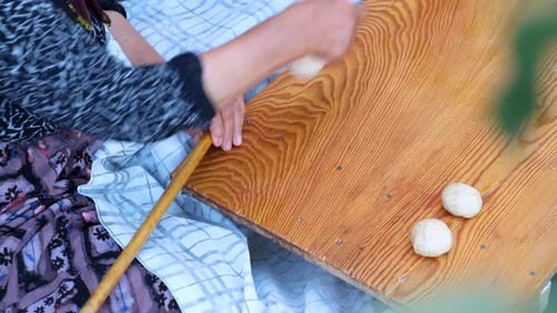 Peasant Woman Who Rolls Dough For Making Bread