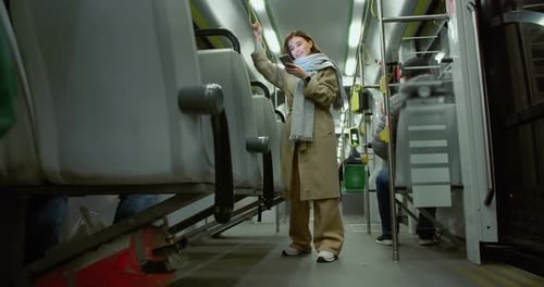 Woman Using Smartphone While Riding Passenger Vehicle