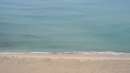 Ocean waves and beach aerial view, natural background.