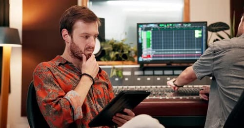 Sound engineer, thinking and tablet in studio for music, production and collaboration