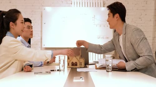 Young Adults Handshake on Real Estate Deal