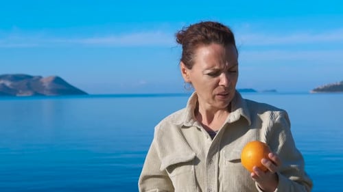 Woman Having an Allergic Reaction to Orange