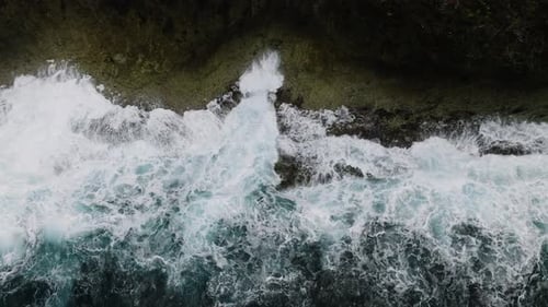 Top View of Waves Hitting Rocky Coastline Siargao Philippines