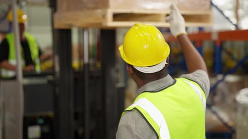 Warehouse Workers Checking and Controlling Boxes in Warehouse