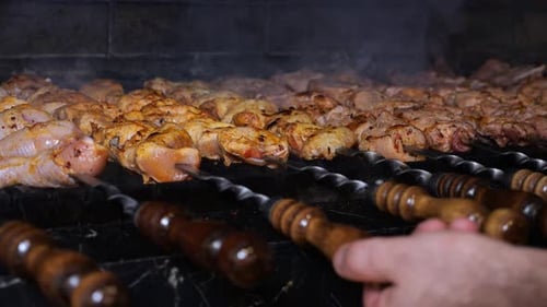 Closeup of a Chef Frying a Barbecue in a Restaurant Kitchen