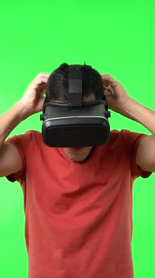 Man Experiences Virtual Reality with VR Headset