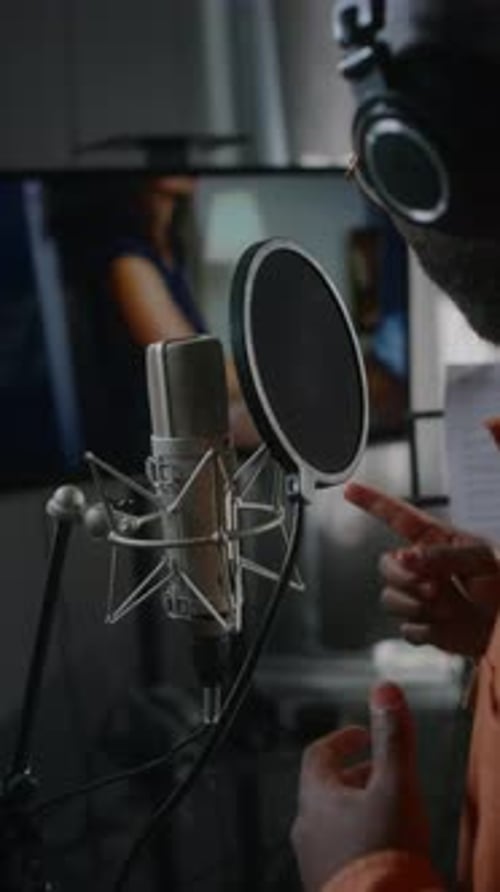 Black Male Voiceover Actor Dubbing Violent Movie Scene in Studio