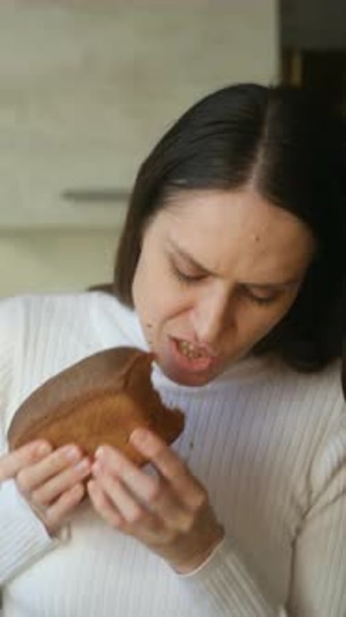 Beautiful Young Woman Eating Fresh Homemade Bread