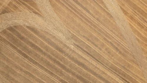 Crop Circle With A Heart Pattern On Rural Fields. - aerial ascend shot