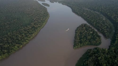 Aerial view of the cruise ship crossing the congo basin rainforest in the DRC.