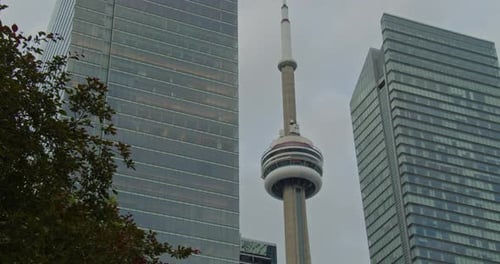 View of the CN Tower Among Skyscrapers on a Cloudy Day in Ontario