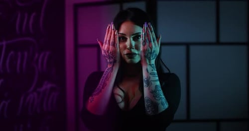 Milan/Italy-01.02.2019:Slow motion of young brunette long hair female master of the art of tattooi