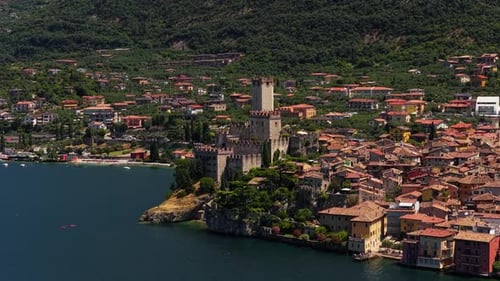 Close drone orbit of Scaliger Castle in Malcesine, Lake Garda