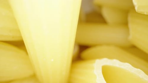 Uncooked Penne Pasta Inside White Box