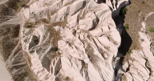 Aerial view of Desert landscape, Towering rock dominates the center, Cappadocia, Turkey