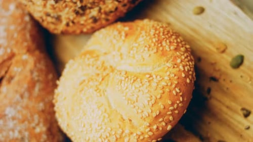 Close-Up of Breads and Rolls on Wooden Board