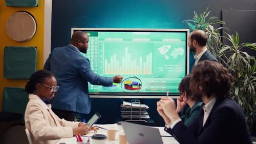 Business Team Analyzing Financial Data on Interactive Screen