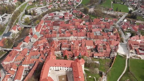A historic medieval castle in Slovenia. Drone shot overview of a castle and museum Skofja Loka, Slov