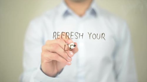 Man Writes Refresh Your Life On Glass