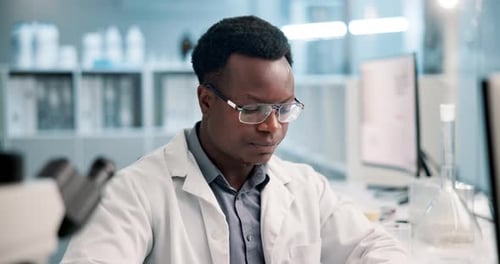 Scientist Working in a Brightly Lit Laboratory