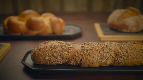 Variety of Artisan Breads on a Wooden Table